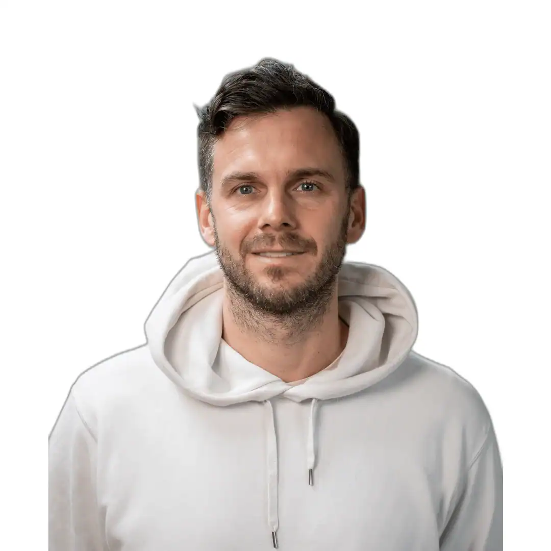 A man in a white hoodie looking at the camera, it's Sebastian Stahl from Buzz Digital